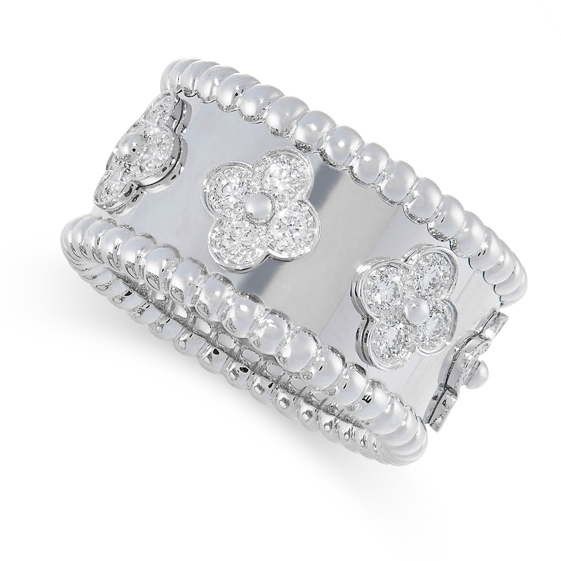 A DIAMOND PERLEE CLOVERS RING, VAN CLEEF & ARPELS in 18ct white gold, the band with seven quatrefoil