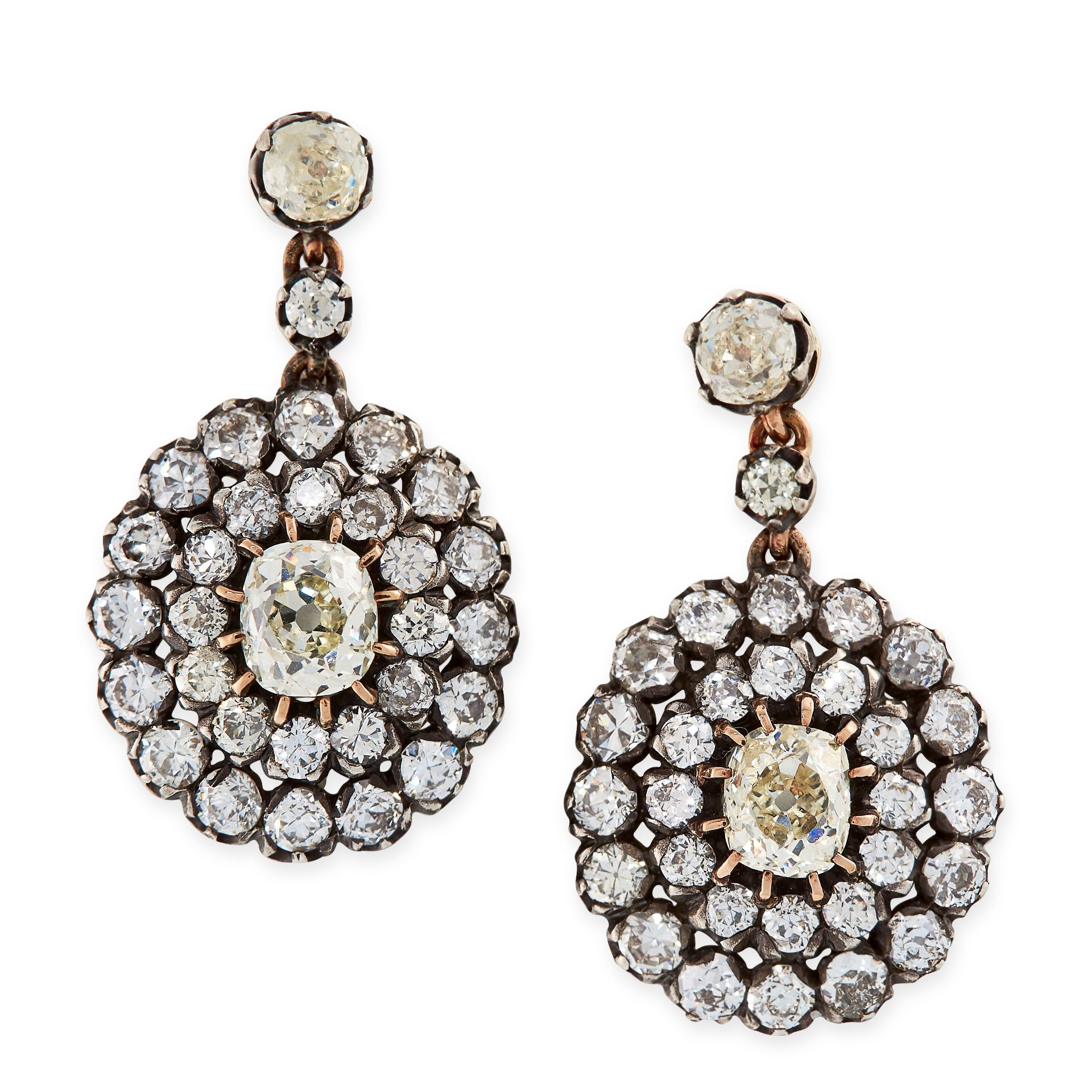 A PAIR OF DIAMOND CLUSTER DROP EARRINGS in yellow gold and silver, each set with a principal old cut