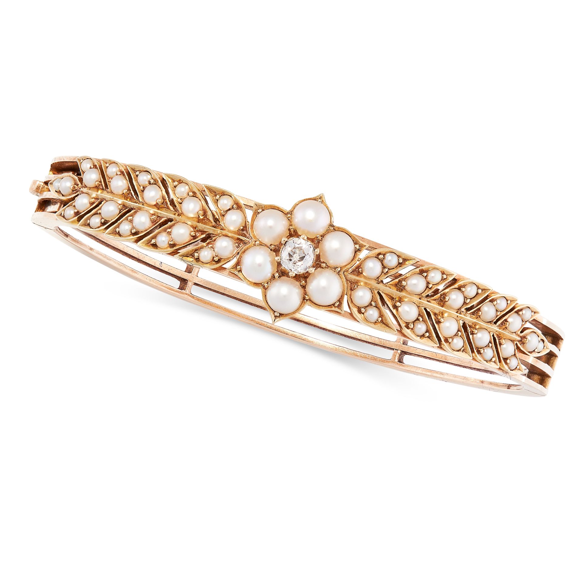 AN ANTIQUE PEARL AND DIAMOND BANGLE, LATE 19TH CENTURY in yellow gold, the openwork body with a