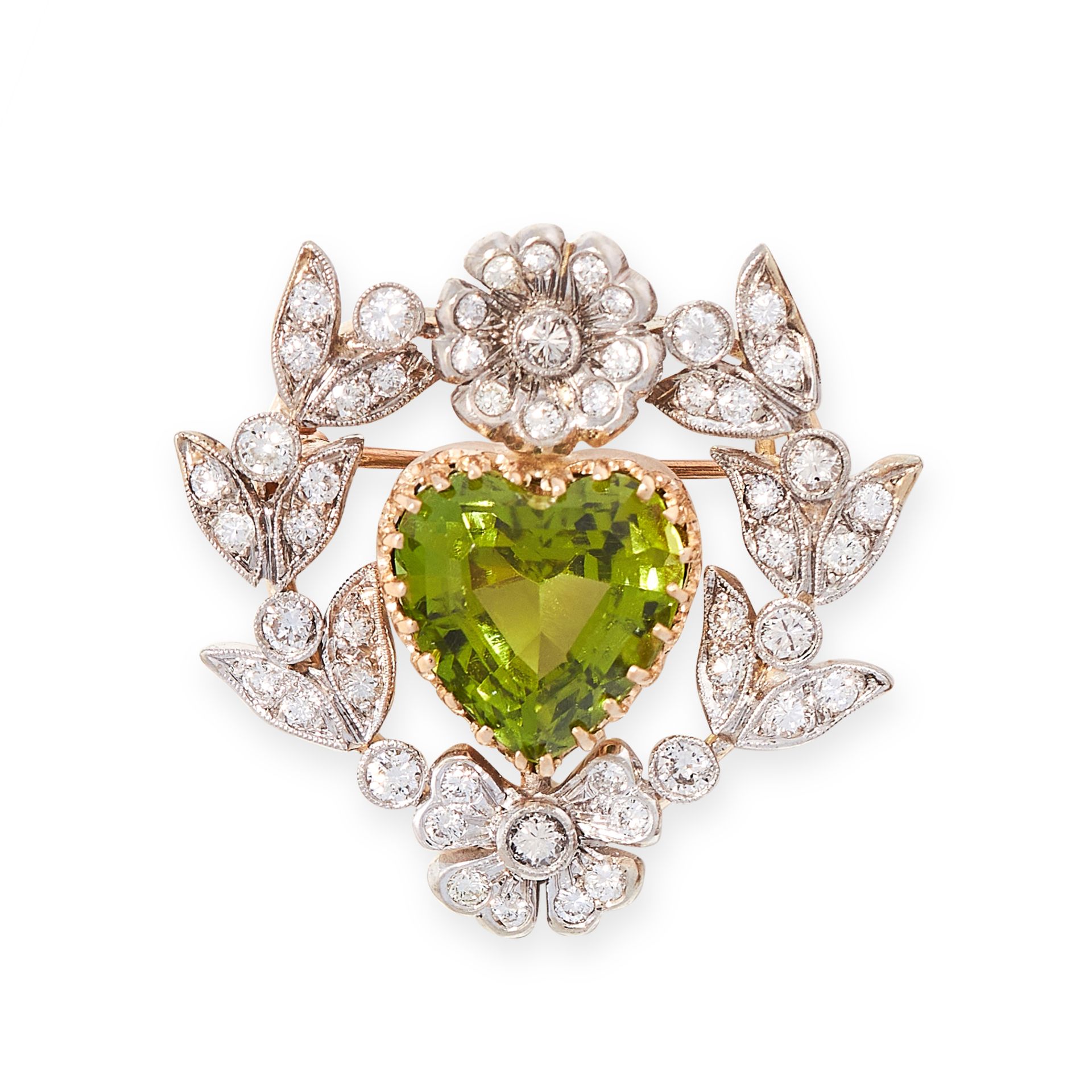 A PERIDOT AND DIAMOND PENDANT / BROOCH in yellow gold and silver, set with a heart shaped peridot of