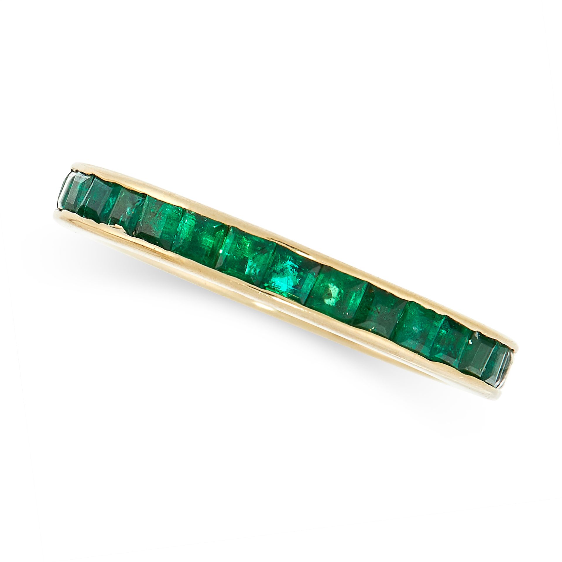 AN EMERALD ETERNITY RING in yellow gold, the band set all around with a single row of step cut