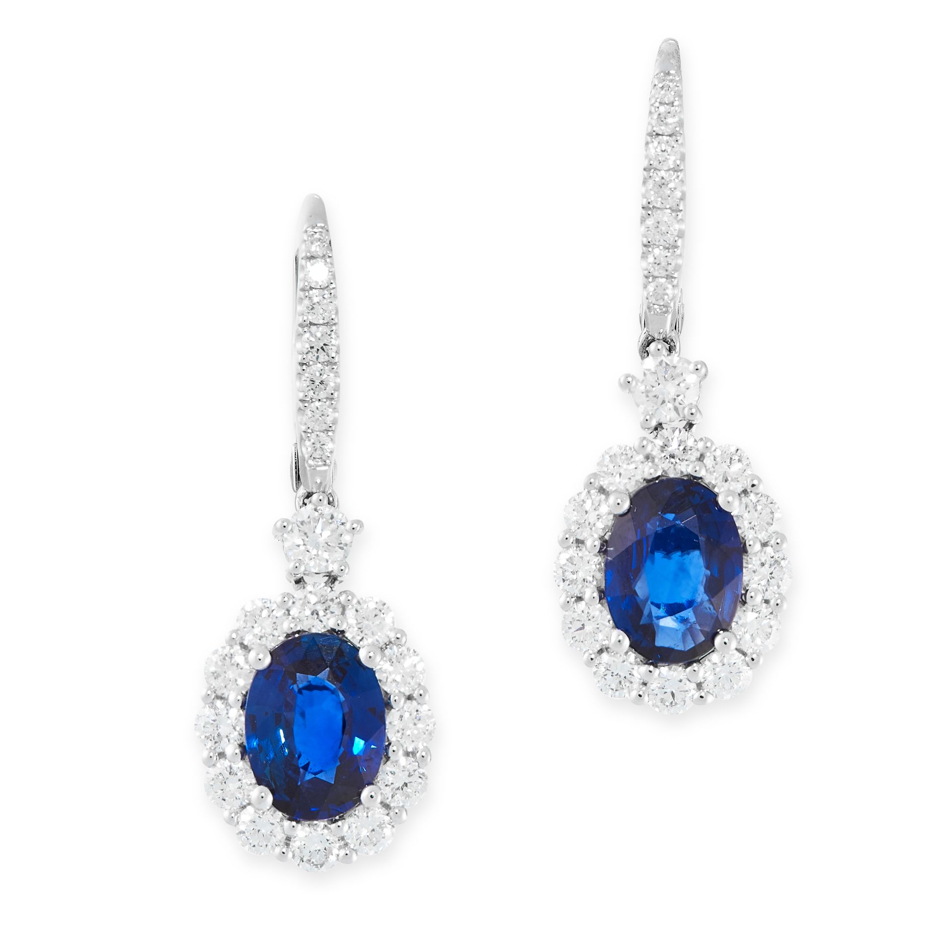 A PAIR OF SAPPHIRE AND DIAMOND EARRINGS in 18ct white gold, each set with an oval cut sapphire