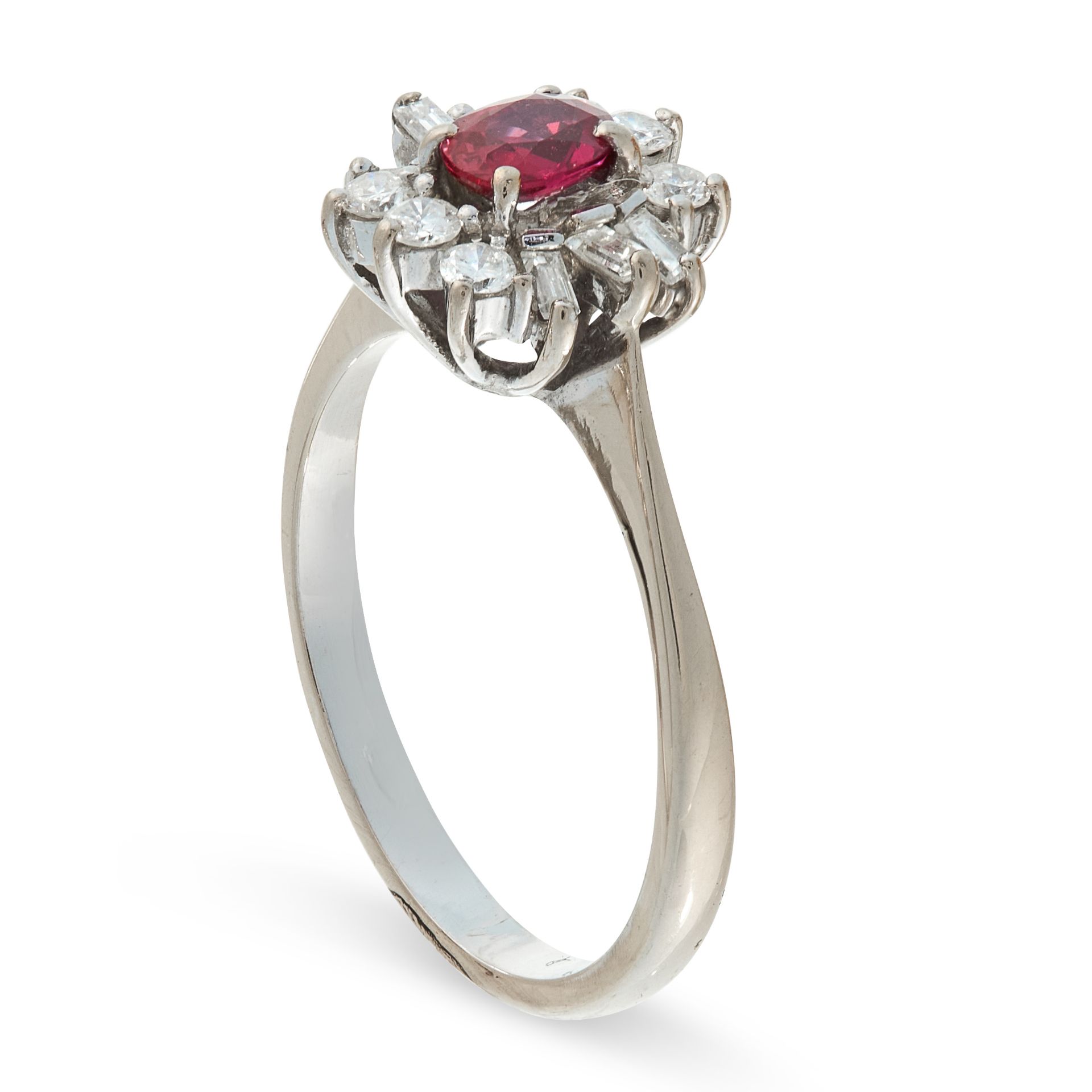 A RUBY AND DIAMOND RING of cluster design, claw set with an oval ruby within a border of brilliant - Image 2 of 2