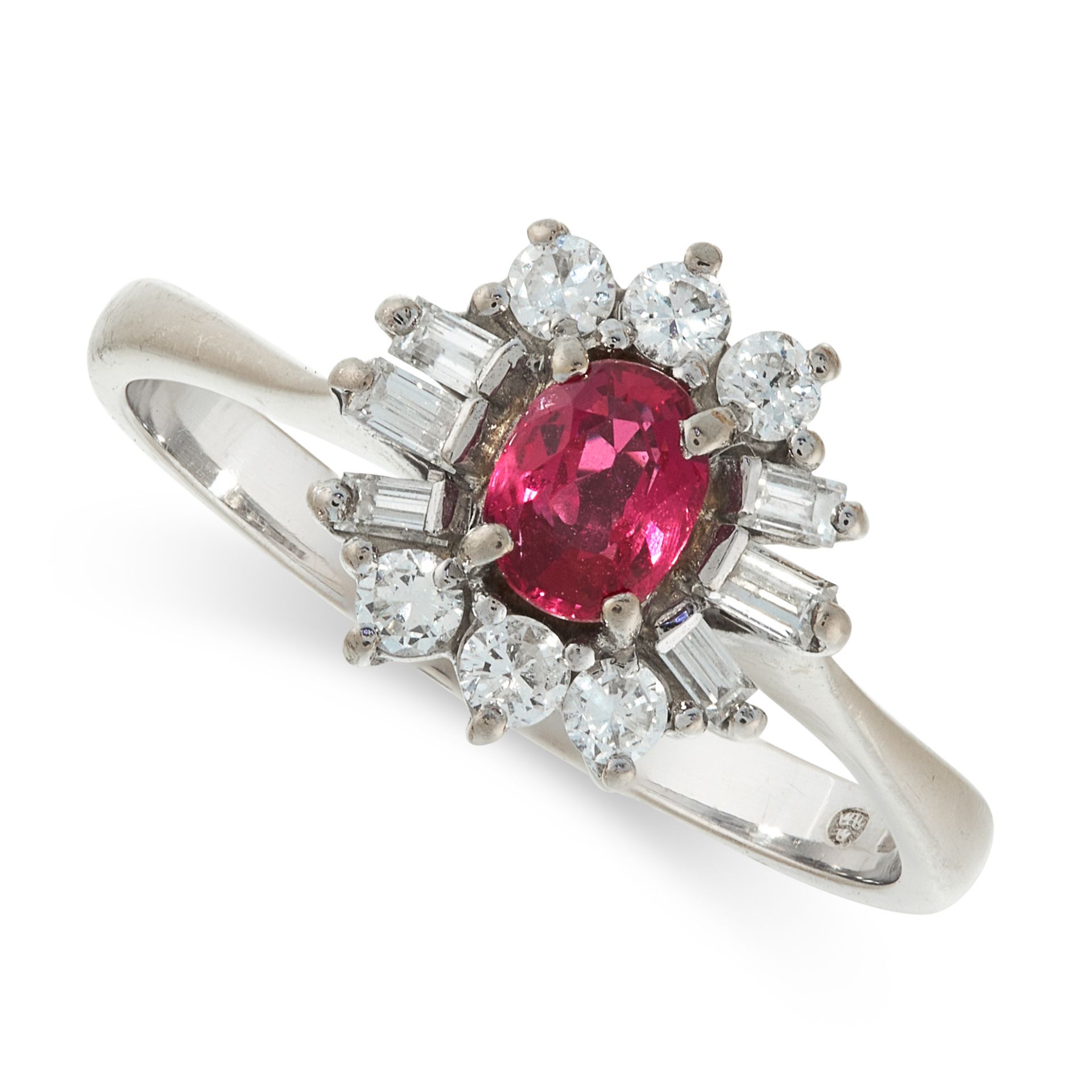 A RUBY AND DIAMOND RING of cluster design, claw set with an oval ruby within a border of brilliant