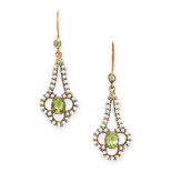 A PAIR OF PERIDOT AND PEARL EARRINGS each set with an oval cut peridot within stylised borders of