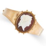 AN ANTIQUE CAMEO MOURNING LOCKET BANGLE, LATE 19TH CENTURY in yellow gold, the hinged body set to