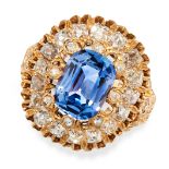 A CEYLON NO HEAT SAPPHIRE AND DIAMOND RING in yellow gold, set with a cushion cut sapphire of 3.11