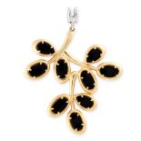 AN ONYX AND DIAMOND PENDANT in 18ct yellow and white gold, designed as a branch, set with polished