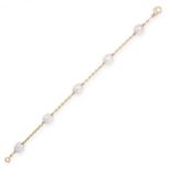 A PEARL BRACELET in 18ct yellow gold, set with five pearls, connected by lengths of chain, stamped