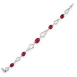 A BURMA NO HEAT RUBY AND DIAMOND BRACELET set with five graduated oval cabochon rubies between