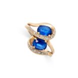 A VINTAGE SAPPHIRE AND DIAMOND RING in 9ct yellow gold, set with two oval cut blue sapphires