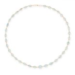 AN AQUAMARINE CHAIN NECKLACE comprising a single row of graduated oval cut aquamarine, stamped