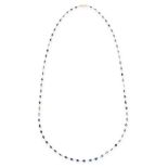 A SAPPHIRE CHAIN NECKLACE comprising a single row of sixty-seven graduated oval and pear cut