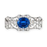 A SYNTHETIC SAPPHIRE AND DIAMOND BROOCH set with a cushion cut synthetic blue sapphire, accented
