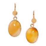 A PAIR OF VINTAGE YELLOW AGATE EARRINGS in yellow gold, each set with an oval cabochon agate, no