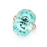 AN AQUAMARINE DRESS RING in yellow gold, set with an oval cut aquamarine of 16.89 carats, no assay