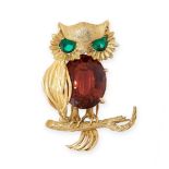 A VINTAGE RED TOURMALINE AND GREEN PASTE OWL BROOCH in 18ct yellow gold, set with an oval cut red