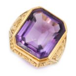 AN ANTIQUE AMETHYST BISHOPS RING in yellow gold, set with an emerald cut amethyst of 20.09 carats,