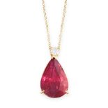 A RUBY AND DIAMOND PENDANT NECKLACE in yellow gold, set with a round cut diamond above a pear cut