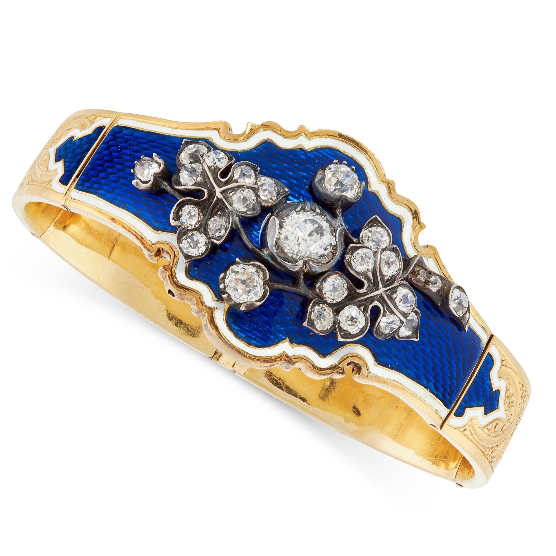 AN ANTIQUE DIAMOND AND ENAMEL BANGLE, 19TH CENTURY in high carat yellow gold and silver, the