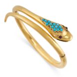 AN ANTIQUE TURQUOISE AND GARNET SNAKE BANGLE, 19TH CENTURY in yellow gold, the hinged body in the