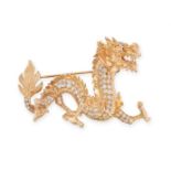 A RUBY AND DIAMOND CHINESE DRAGON BROOCH in yellow gold, realistically modelled as a Chinese dragon,