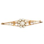 A VINTAGE PEARL BROOCH in yellow gold, set with a cluster of pearls, accented by foliate motifs