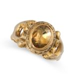 AN ANTIQUE GEMSET DRESS RING set with an oval cut yellow gemstone, between scrolling shoulders, no