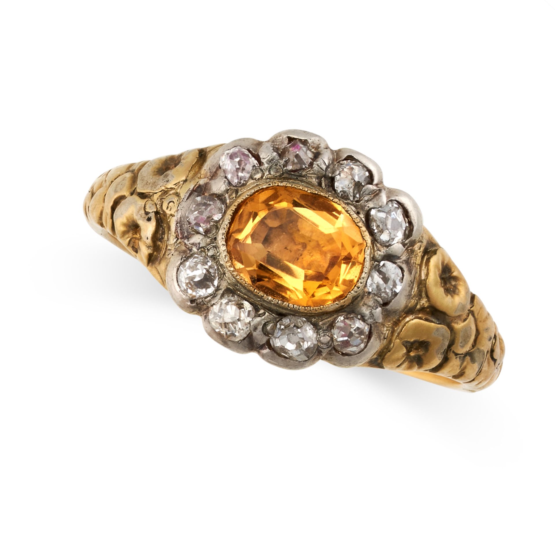 AN ANTIQUE IMPERIAL TOPAZ AND DIAMOND RING in yellow gold and silver, set with an oval cut