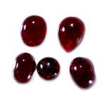 A MIXED LOT OF UNMOUNTED GARNETS cabochon, 51.70 carats.