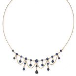 A VINTAGE SAPPHIRE FRINGE NECKLACE in 14ct yellow gold, comprising a row of cabochon sapphires