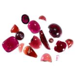 A MIXED LOT OF UNMOUNTED GARNETS cabochon and fragments, totalling 94.45 carats.