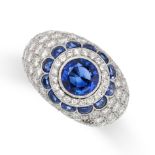 A SAPPHIRE AND DIAMOND DRESS RING in platinum, the tapering band of bombe design, set with a central