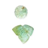 TWO UNMOUNTED MUGHAL CARVED EMERALDS carved with foliate designs, both totalling 7.34 carats.