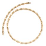A GOLD NECKLACE AND BRACELET SUITE in 14ct yellow gold, each comprising a series of bamboo style
