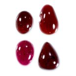 A MIXED LOT OF UNMOUNTED GARNETS cabochon, 63.44 carats.