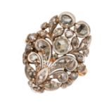 AN ANTIQUE DIAMOND DRESS RING, 19TH CENTURY in yellow gold and silver, the openwork face of