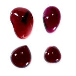 A MIXED LOT OF UNMOUNTED GARNETS cabochon, totalling 62.83 carats.