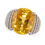 A MAGNIFICENT CEYLON NO HEAT YELLOW SAPPHIRE AND DIAMOND RING in platinum, set with a cushion cut