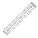 A DIAMOND BRACELET in 18ct white gold, the openwork body formed of a series of articulated links set