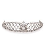 AN EXQUISITE ANTIQUE DIAMOND TIARA, EARLY 20TH CENTURY in platinum and yellow gold, the stylised