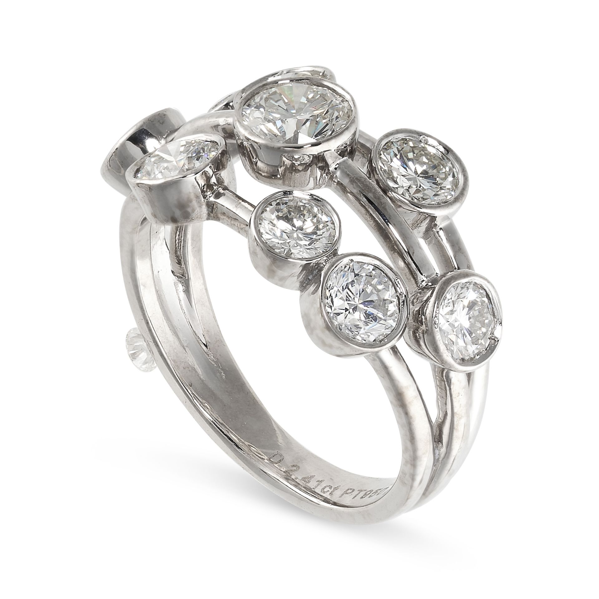 A DIAMOND DRESS RING in platinum, the open wirework band collet-set with round cut diamonds, the - Bild 2 aus 2