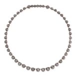 A DIAMOND RIVIERE NECKLACE in yellow gold and silver, comprising a single row of forty-eight