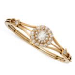 A DIAMOND BANGLE in 18ct yellow gold, the tapering body set to the front with a cluster formed of