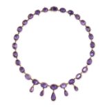 A FINE ANTIQUE AMETHYST RIVIERE NECKLACE, 19TH CENTURY in yellow gold, comprising a single row of