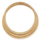 A VINTAGE GASPIPE COLLAR NECKLACE, CARTIER PARIS in 18ct yellow gold and white gold, formed of three