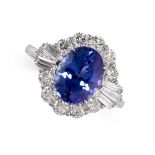 A TANZANITE AND DIAMAOND RING in 18ct white gold, set with an oval cut tanzanite of 3.40 carats,