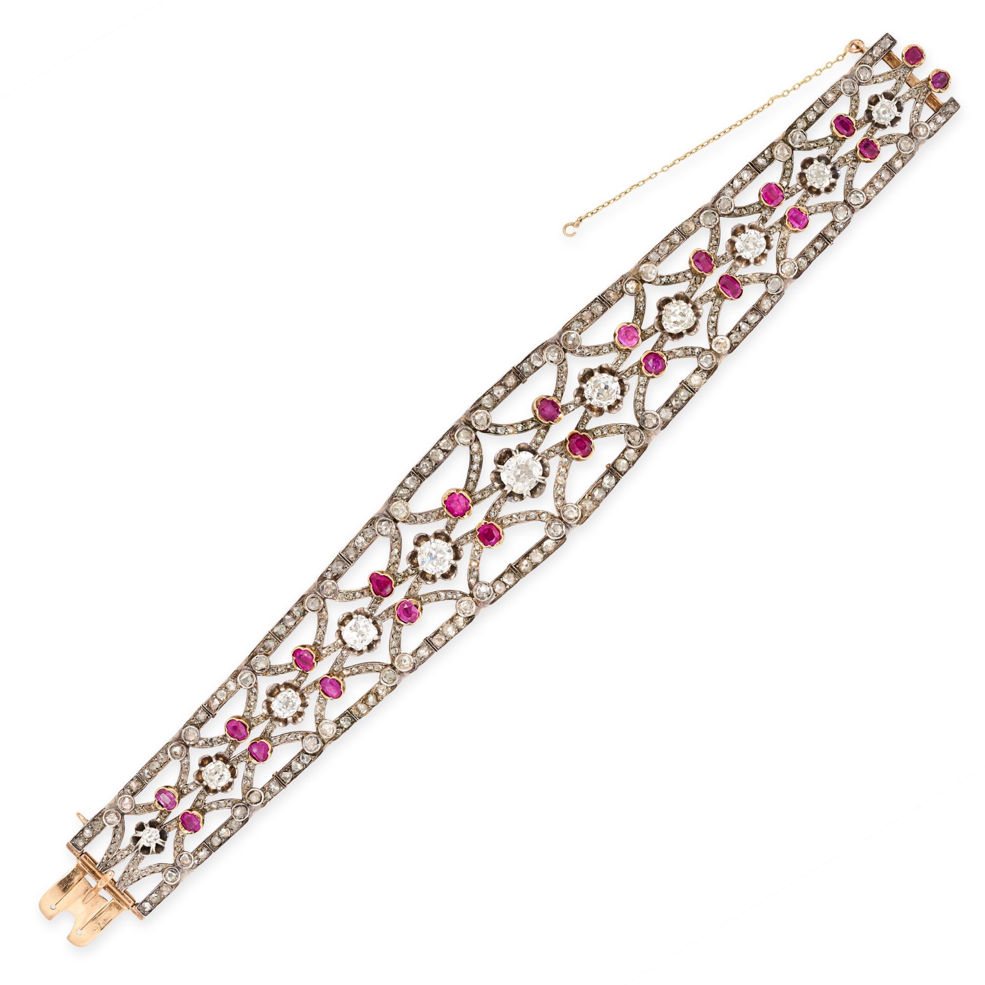 AN ANTIQUE RUBY AND DIAMOND BRACELET in silver and 18ct yellow gold, of tapering design set with a