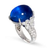 AN IMPORTANT CEYLON NO HEAT STAR SAPPHIRE AND DIAMOND RING in platinum, set with an oval cabochon