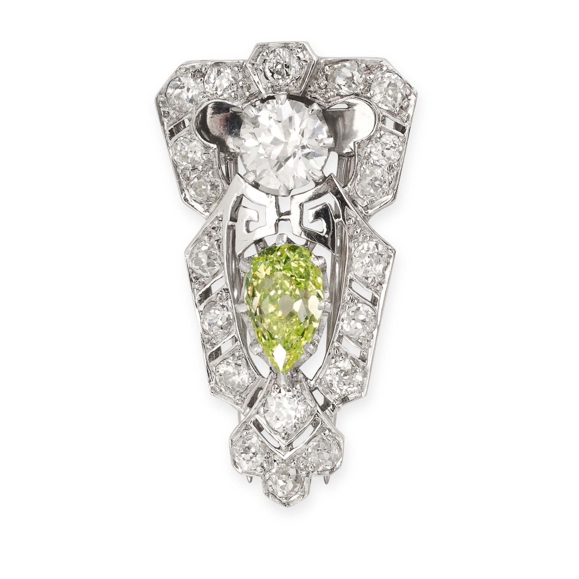 A FINE FANCY GREENISH YELLOW DIAMOND AND WHITE DIAMOND CLIP BROOCH of shield shaped design, set with